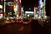 A night view of Shinjuku, with lots of neons, quite crowded