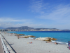 A view of "Baie des Anges" in Nice, with a turquoise sea and not too many poeple.